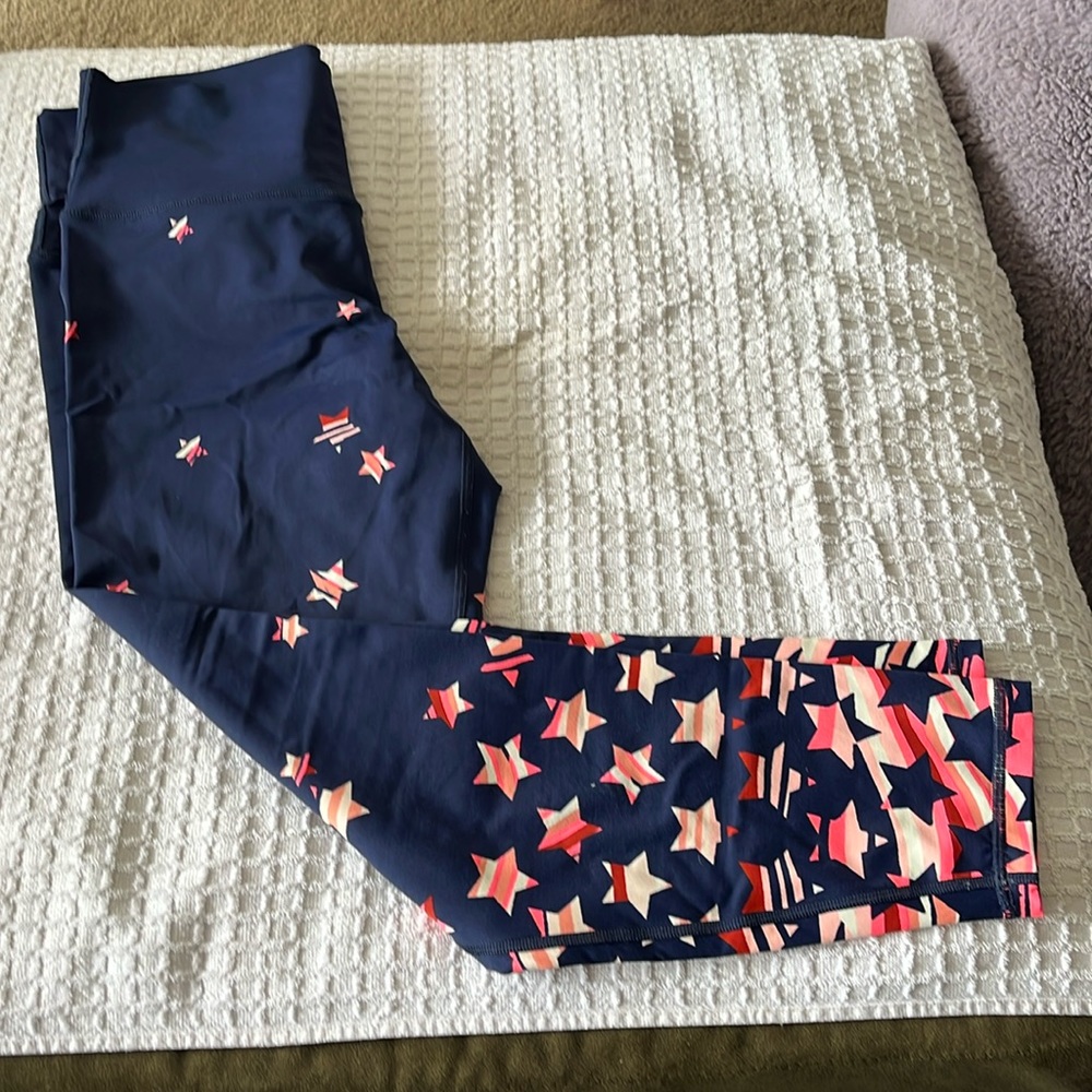 Aeria large leggings blue with orange stars.